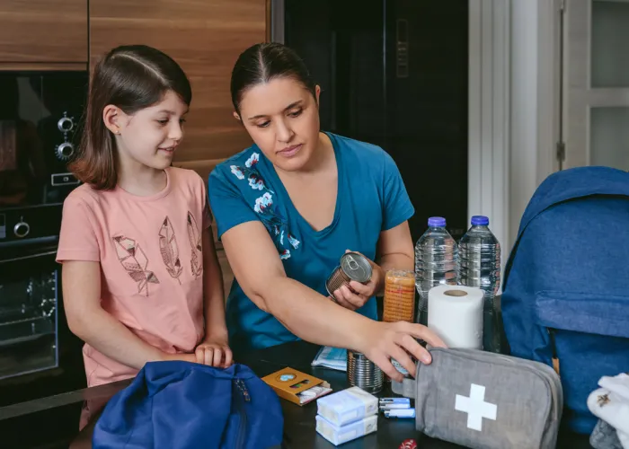 woman and child with emergency kit